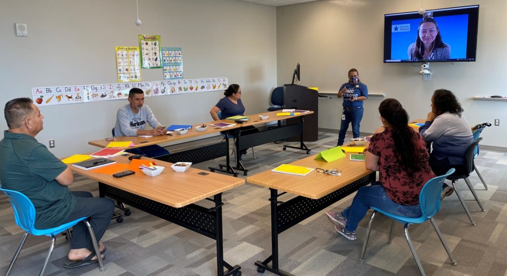 Students sitting around a table in a classroom